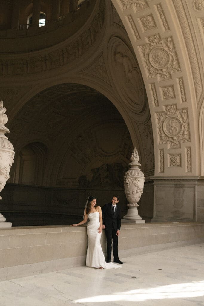 Bride and groom portrait inside San Francisco City Hall 