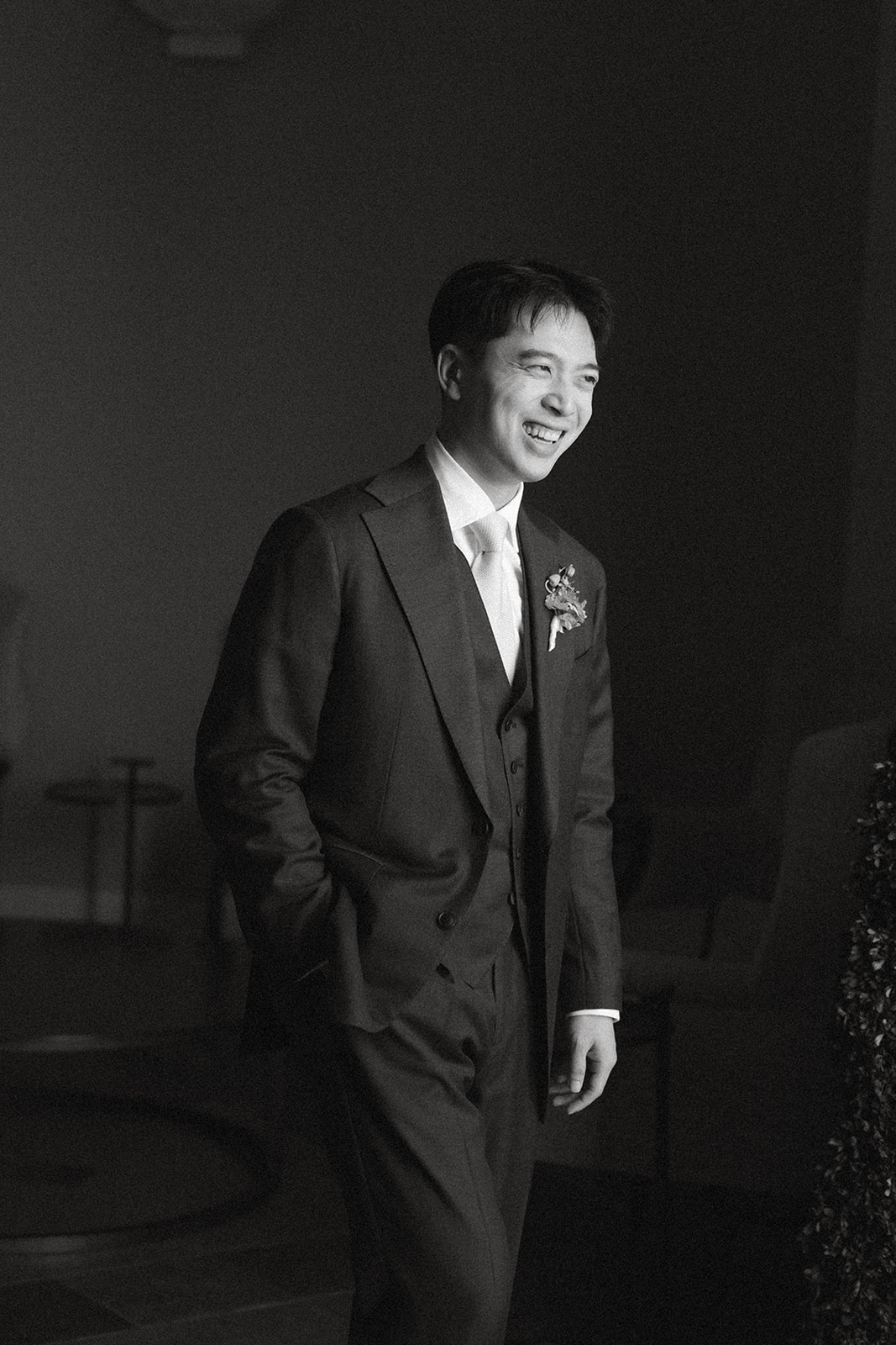 Groom smiling in a tailored suit before the ceremony at casa real at ruby hill winery, captured in timeless casa real at ruby hill winery photos.