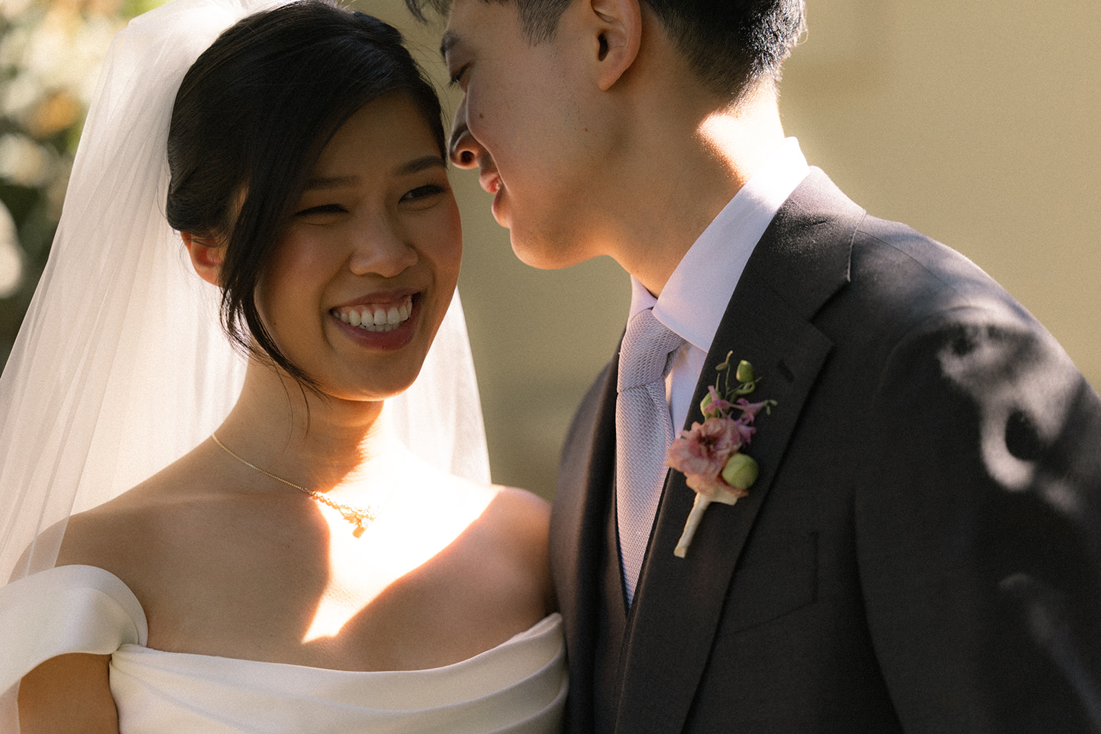 Bride smiling beside the groom during their wedding day at casa real at ruby hill winery, one of the most elegant bay area wedding venues.