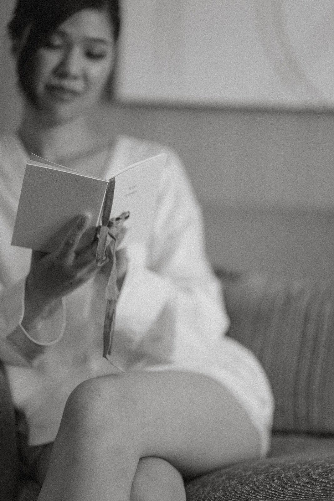 ride reading a handwritten letter while getting ready before her ceremony at casa real at ruby hill winery.