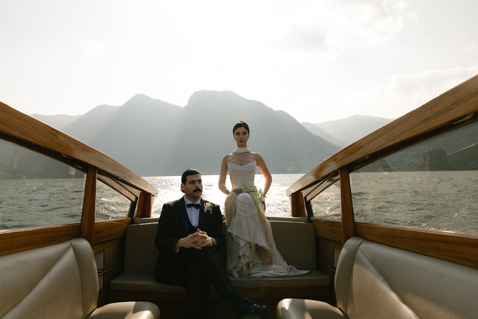 destination wedding in Italy with bride and groom on a boat for bridal photos at Lake Como