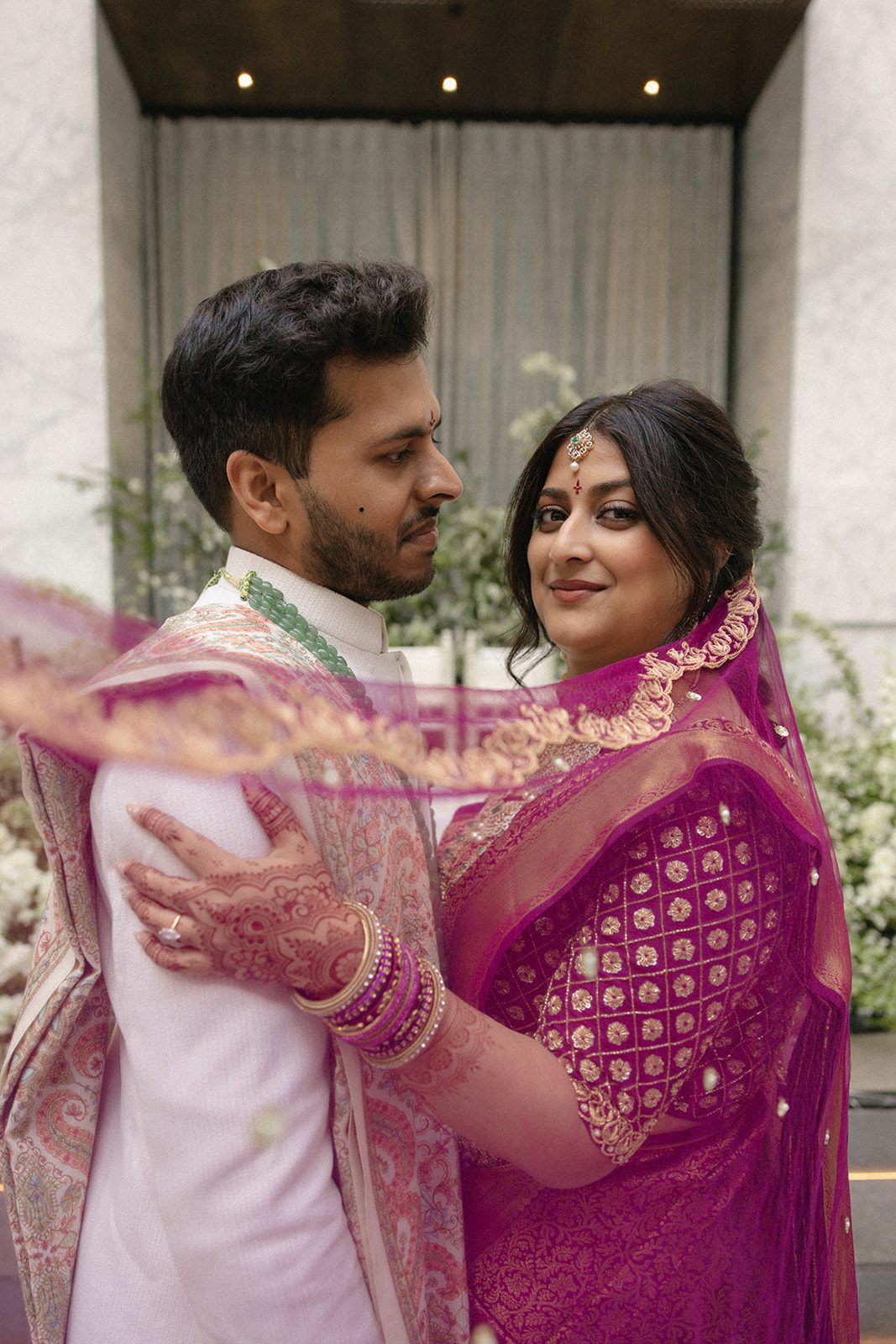 Telugu wedding couple in traditional attire embracing during their wedding at The Conservatory at One Sansome.