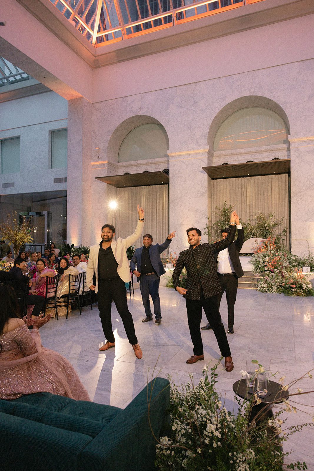 Groom and friends perform a choreographed dance during the Indian wedding reception at the Conservatory at One Sansome.